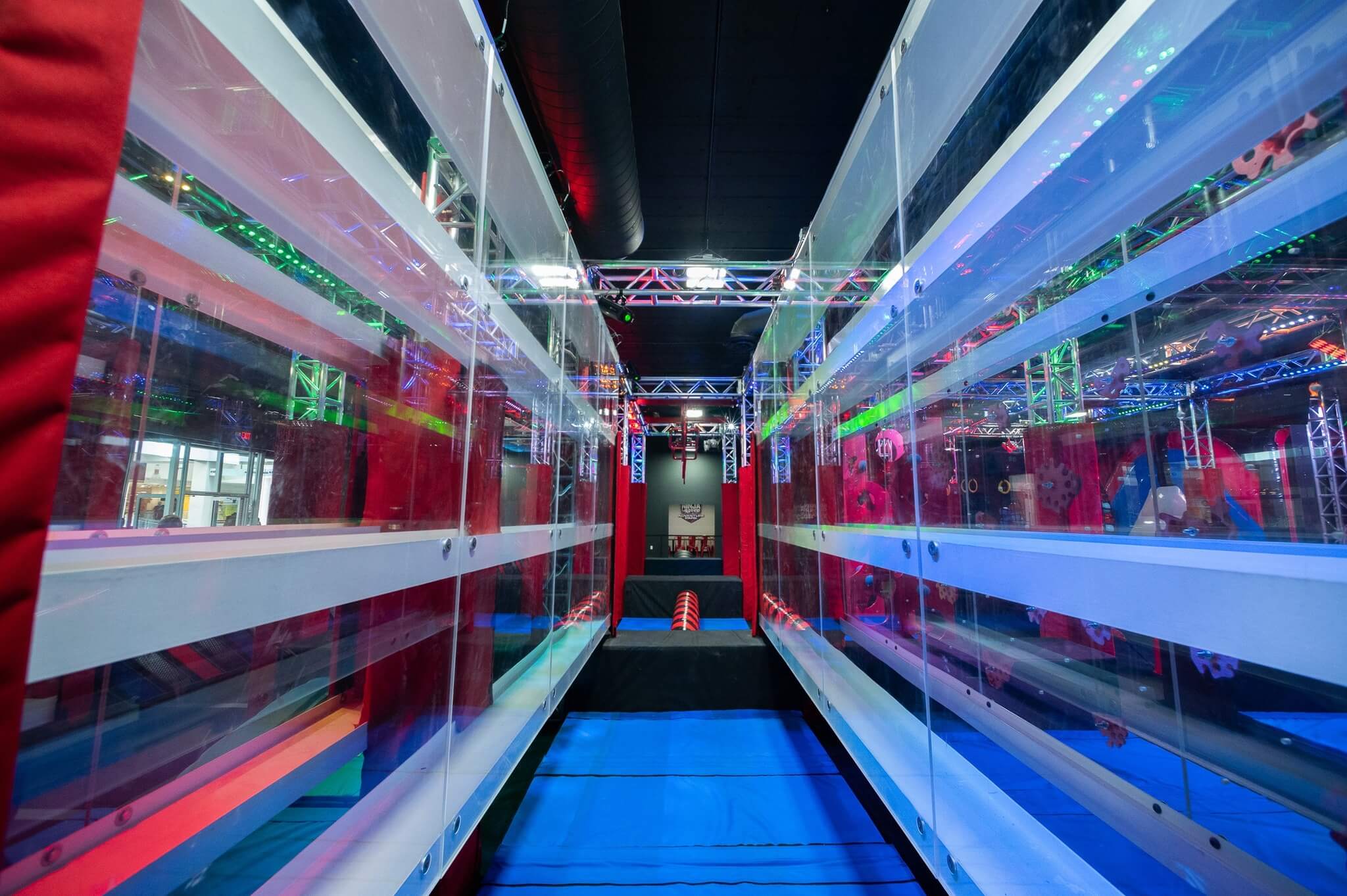 Used as part of a ninja course. Competitors jump up and prop themselves between the two Plexiglas walls.